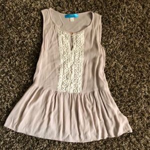 Flair bottom tank top with lace detail.